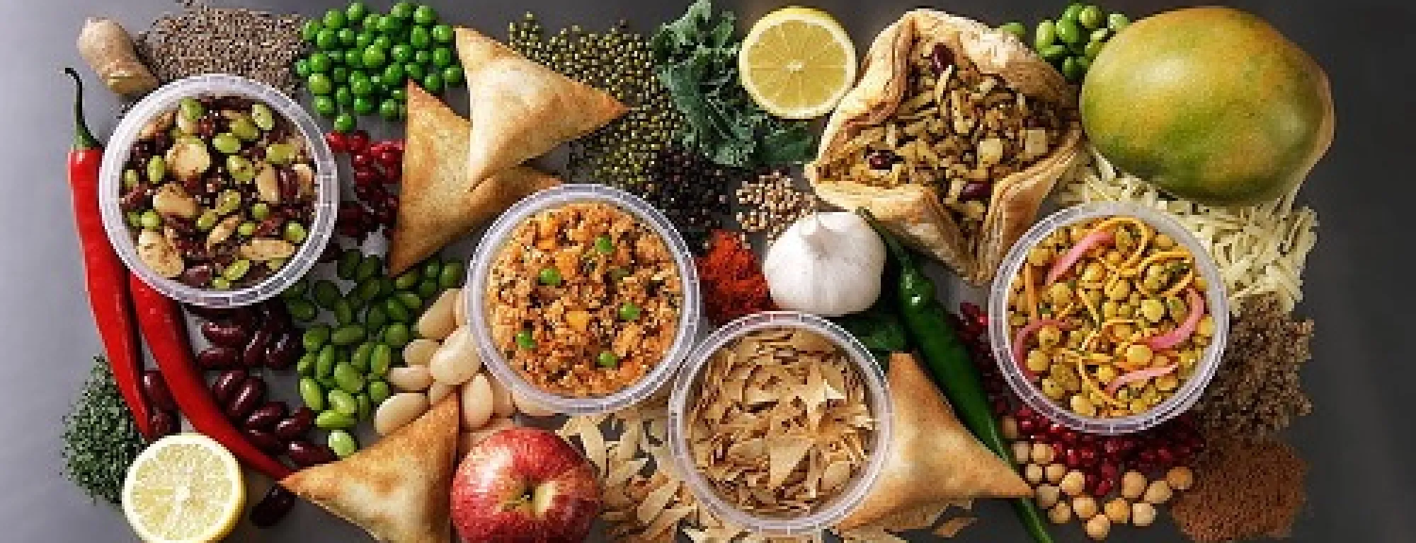 Variety of fruits, vegetables and grains displayed on a table