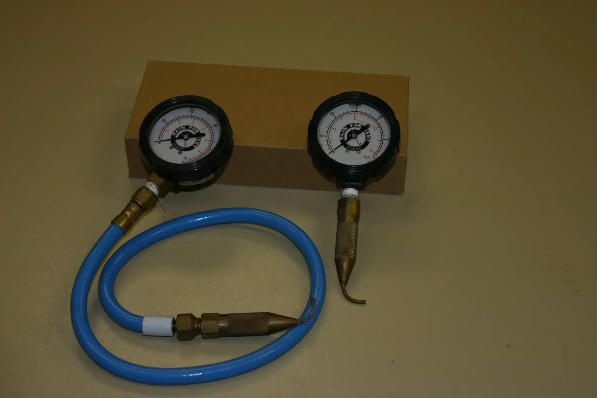 Pressure gauges with attached pitot tubes for measuring pressure inside drip tubing. Photo: L. Schwankl.