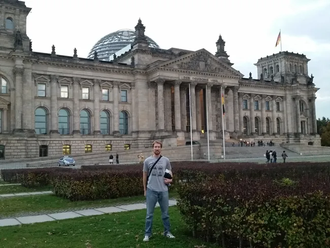 World traveler and scientist Matan Shelomi, wearing a Bohart Museum of Entomology shirt at at the Reichstag in Berlin.