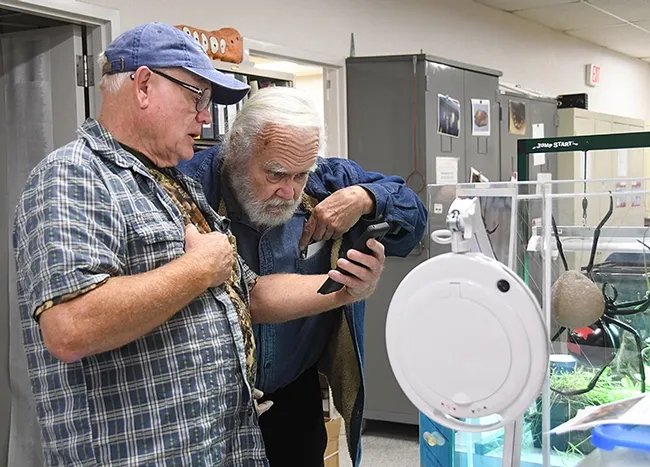 Dick Meyer, who holds a doctorate in entomology from UC Davis, clarifies a butterfly question with hobbyist Jeff Baier of Napa. (Photo by Kathy Keatley Garvey)