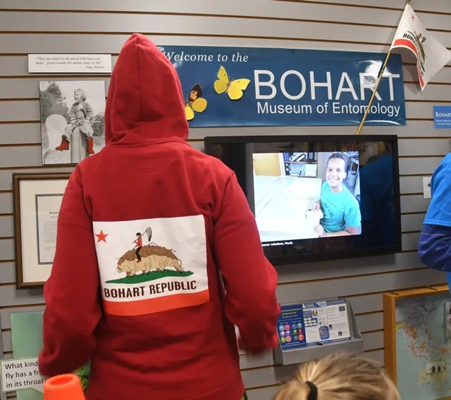 Back view: Entomologist-artist Charlotte Herbert Alberts shows the Bohart Republic's bear flag, the water bear, that is. (Photo by Kathy Keatley Garvey)