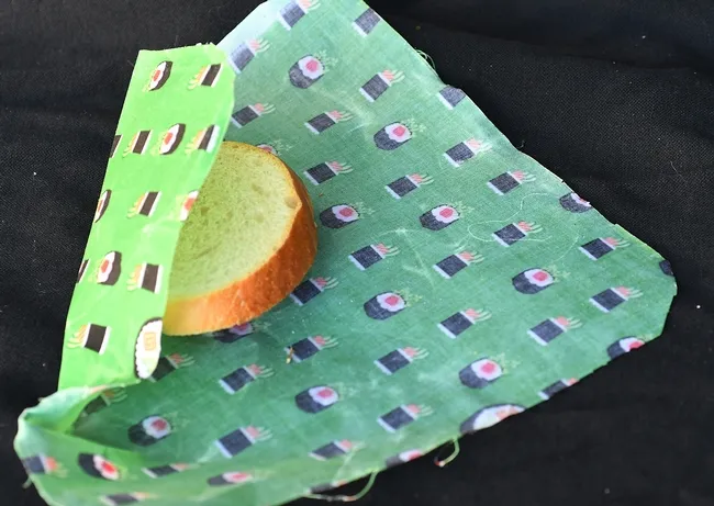 It's a wrap! Reusable wax wrappers are used to wrap sandwiches and other foods. They are environmentally friendly, sustainable and economical. This wax wrap is the work of Vacaville artist and crafter Teresa Hickman of Vacaville ("handmadebyTeresa" on Facebook), who sells these (along with tote bags and zippered pounches) at the Davis Farmers' Markets and other venues. (Photo by Kathy Keatley Garvey)