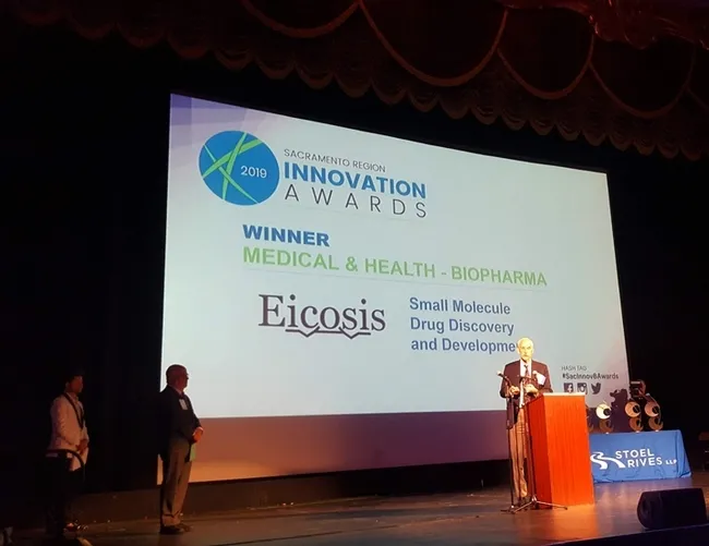 This was the scene at the Sacramento Region Innovation Awards program when EicOsis was named winner of the medical and healthy/biophrmaceutical category. Pictured is William Schmidt, Ph.D, in charge of clinical development for EicOsis. (Photo courtes of Robb Wright)