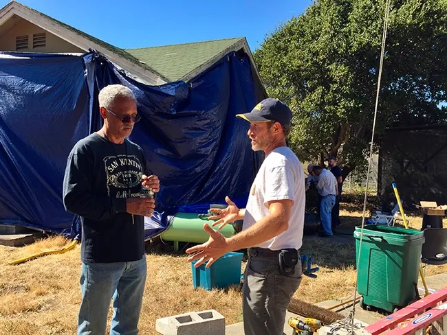 In this image, taken in October 2018, consultant and mentor Vernard Lewis (left), confers with Andrew Sutherland, UC integrated pest management advisor for Bay Area counties, about the Villa Termiti at the UC Berkeley Field Station. Sutherland, who holds a doctorate in entomology from UC Davis, was recently awarded state funding to remodel the Villa for future training of pest management professionals in the state. (UC ANR Photo by Pam Kan-Rice)