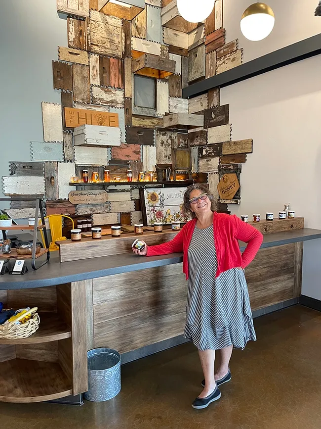 Amina Harris, the self-described "Queen Bee" of her family-owned Z Specialty Food, is photographed in the tasting room of The HIVE.