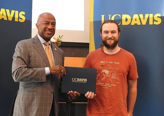 UC Davis entomologist Brennen Dyer, a lab assistant at the Bohart Museum of Entomology, with UC Davis Chancellor Gary May. (Photo by Kathy Keatley Garvey)