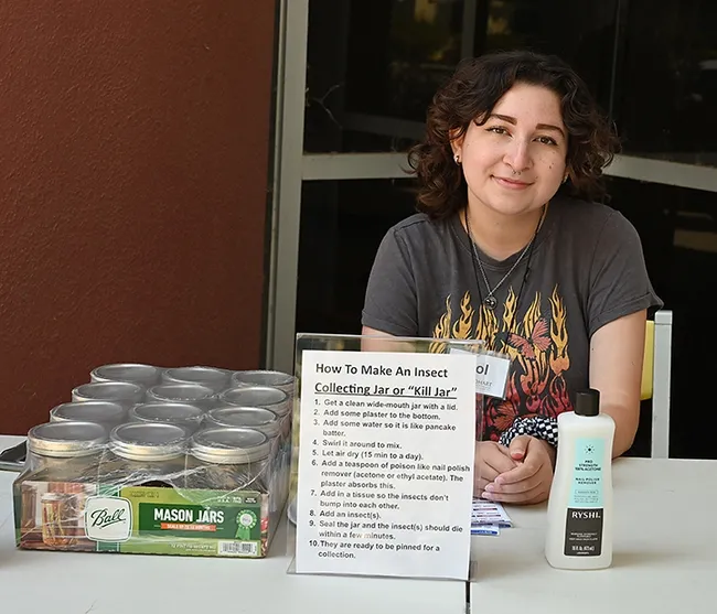 UC Davis entomology senior Sol Wantz, president of the Entomology Club, showed open house visitors how to make an insect collecting jar or "kill" jar. (Photo by Kathy Keatley Garvey)