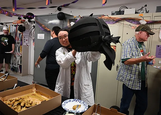 Allen Chew's self-created horse fly costume drew lots of praise. Also pictured are (far left) arachnologist-geneticist Jim Starrett, and (far right) Dick Meyer, a UC Davis doctoral alumnus who retired from a medical entomology career. (Photo by Kathy Keatley Garvey)