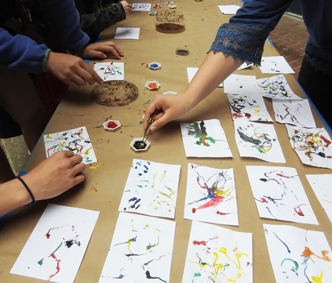 Maggot art is among the popular activities at Briggs Hall during the annual UC Davis Picnic Day. Artists dip maggots in water-based, non-toxic paint. (Photo by Kathy Keatley Garvey)