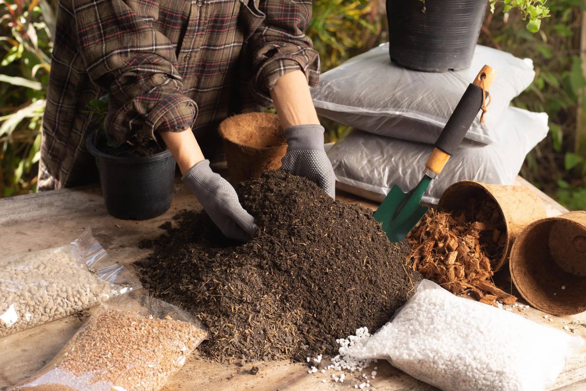 A woman builds her own potting soil - Courtesy Shutterstock