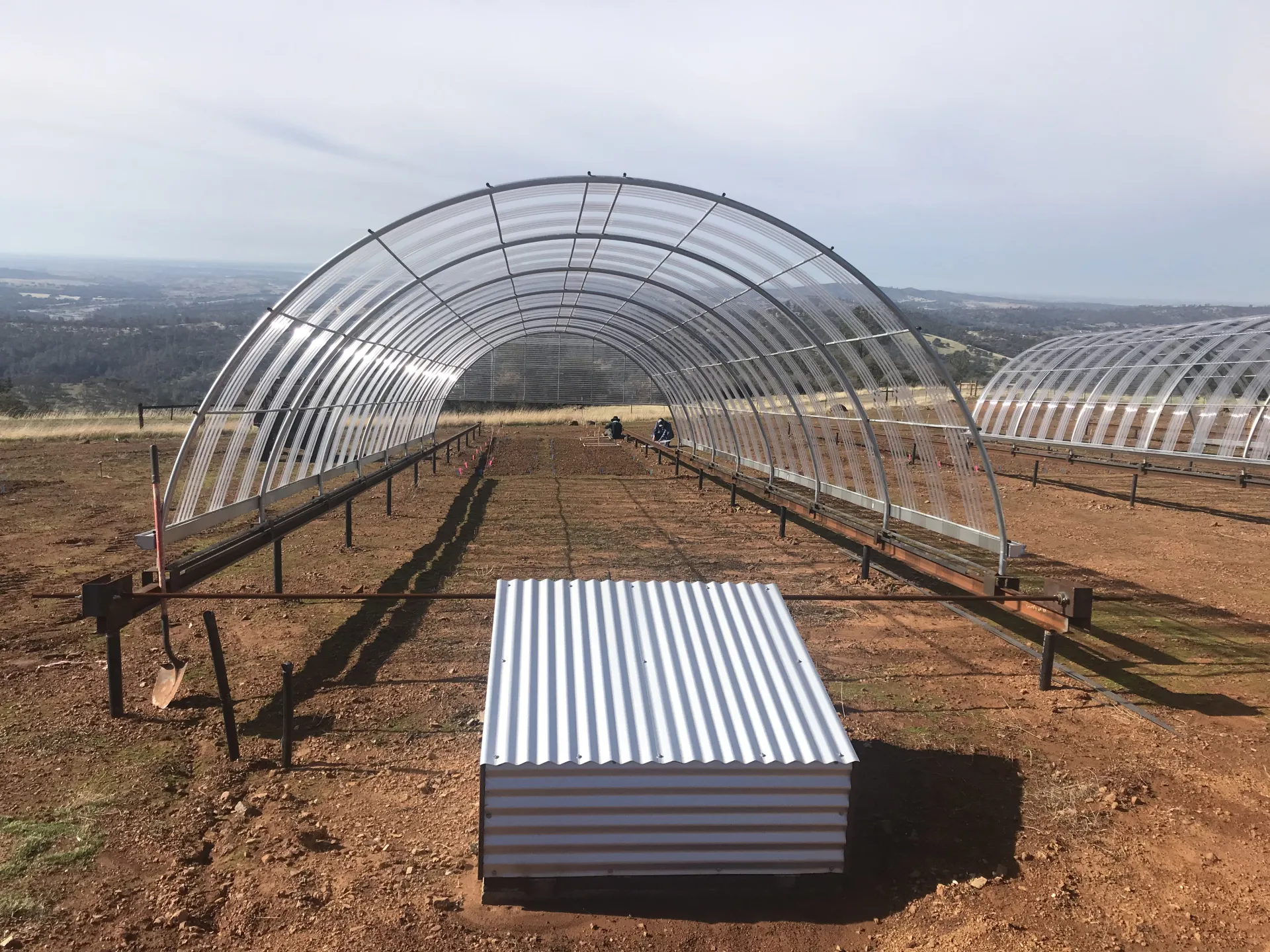 Movable 16'x50' green house structure that can be deployed over plots and reduce rainfall by 50%