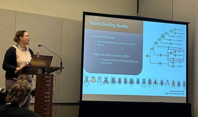 UC Davis doctoral student Iris Quayle of the Jason Bond lab discussing her research on "A (Finally) Complete Phylogeny for the Charismatic Genus Onymacris Using Ultraconserved Elements." (Photo courtesy of Lexie Martin)