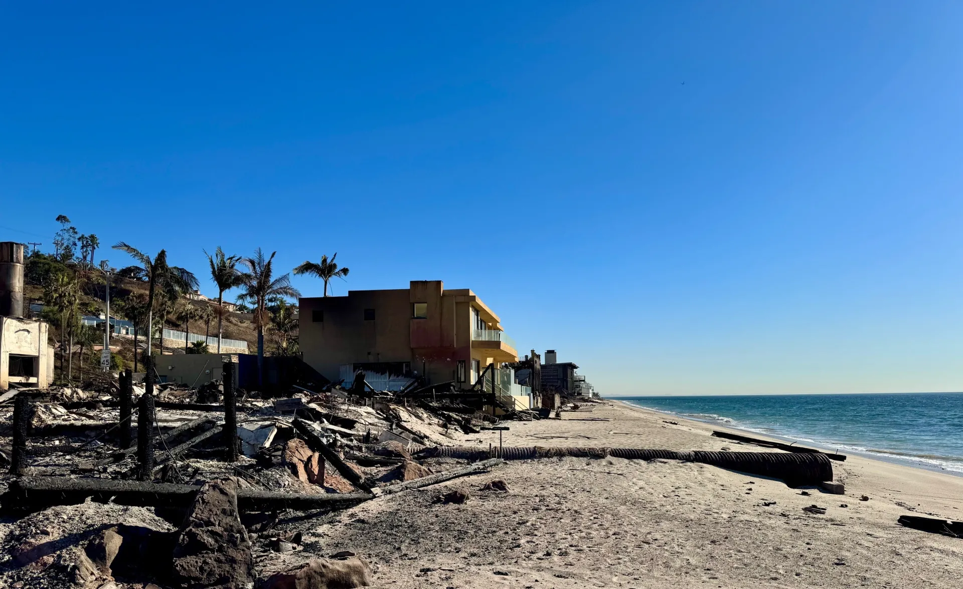 Houses burned next to the beach