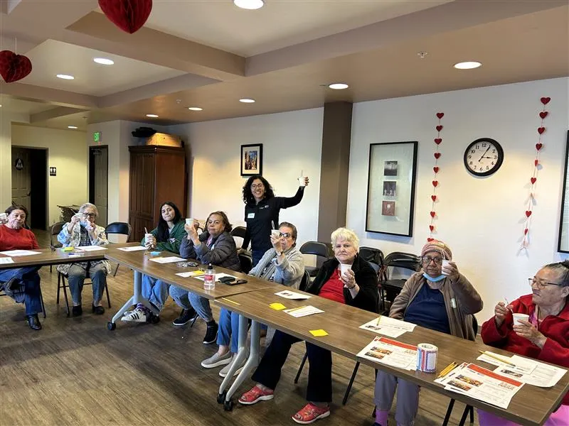 Community members at ‘Oaks on Florence’ senior center in the city of Bell participate in a nutrition class taught by Ingrid Alarcón, a community education specialist with CalFresh Healthy Living, UC.