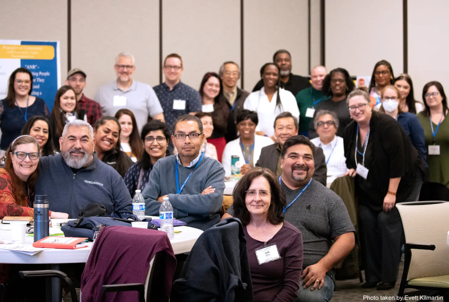 Group of people at the WIB summit smiling into the camera