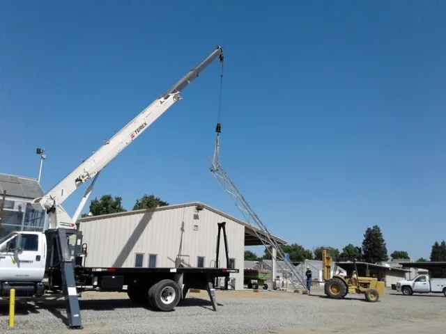 Workers at Kearney raise a tower to blanket the 330-acre research center with high-speed wireless internet. Photo by Julie Sievert