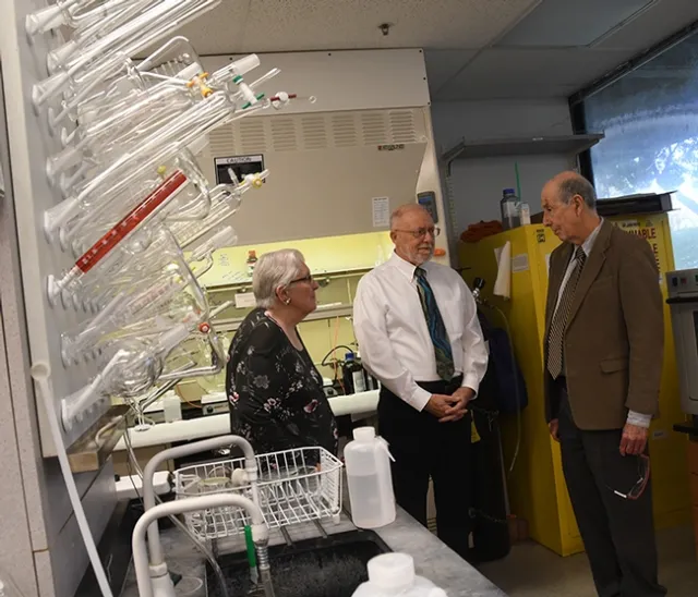 Western Neuropathy Association president Bev Anderson and treasurer Darrell O'Sullivan (center) chat with UC Davis distinguished professor Bruce Hammock about his work. Hammock researches an enzyme aimed at controlling acute and neuropathic pain. EicOsis, the Davis company that Hammock founded to move inhibitors of the soluble epoxide hydrolase into the human clinical trials. (Photo by Kathy Keatley Garvey)