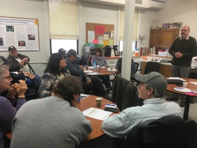Domenic Fino talks with a room of farmers about crop insurance options at the January 9th Farmer-to-Farmer Breakfast in Auburn.