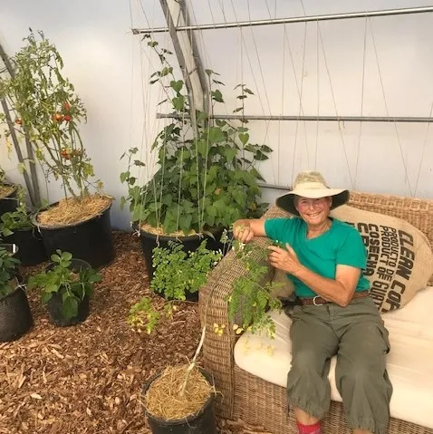 Below) Vidaver poses next to Moringa and Sweet Potatoes.