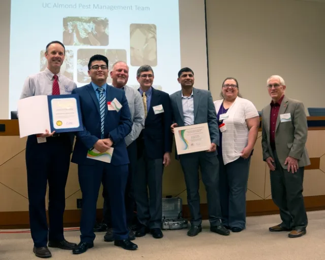 The Almond Pest Management Alliance Team was also recognized by California State Assemblymember Rudy Salas. Pictured in the photo are (left to right), David Haviland (UCCE-Kern), Raul Calderon (Office of Rudy Salas, CA Assembly District 32), Brad Higbee (Trécé), Chuck Burks (USDA), Jhalendra Rijal (UCIPM), Stephanie Rill (UCCE- Kern), Bob Curtis (Almond Board of California).