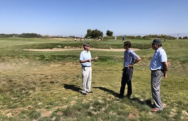 Golf course superintendents discuss demonstrations of naturalized areas on a golf course in Dinuba, CA. Photo by Maggie Reiter.