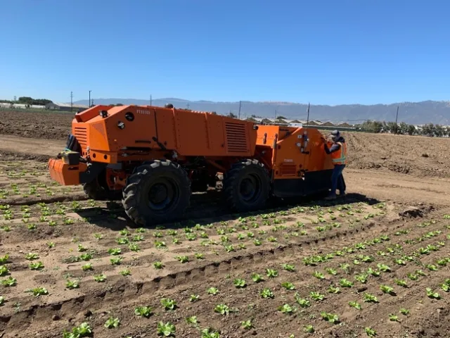 Photo 2. FarmWise Titan autonomous tractor equipped with split knives