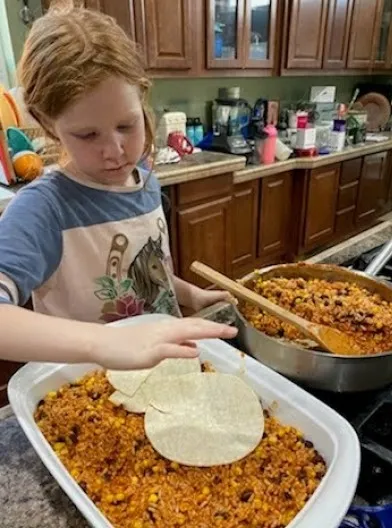 Youth preparing food dish