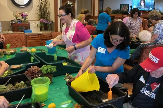 UC Master Gardeners help older San Diego County resident with tabletop gardening.