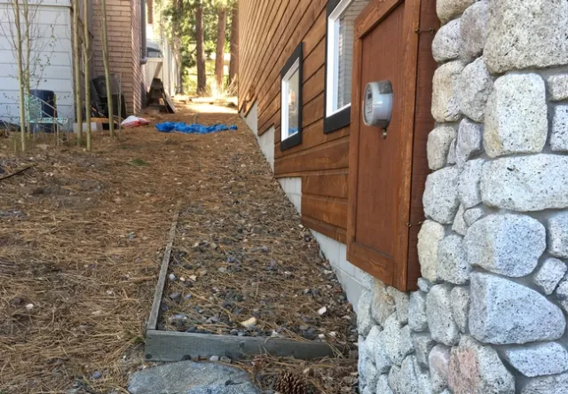 Dry pine needles and leaves can be ignited by falling embers. Valachovic recommends clearing vegetation that is within 5 feet of the house.