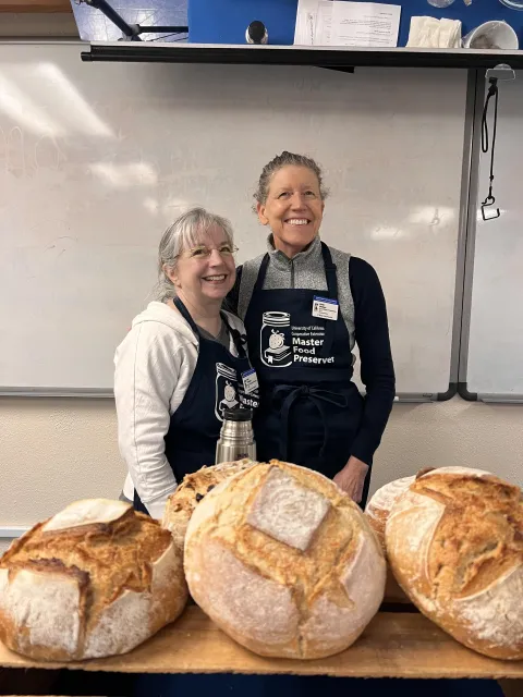Volunteers at sourdough workshop with bread samples