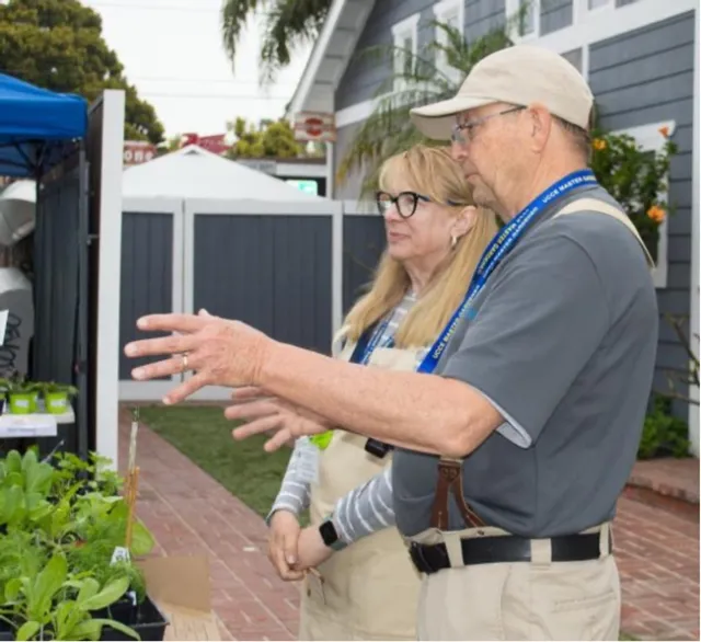 Kelly Christensen with a fellow gardener