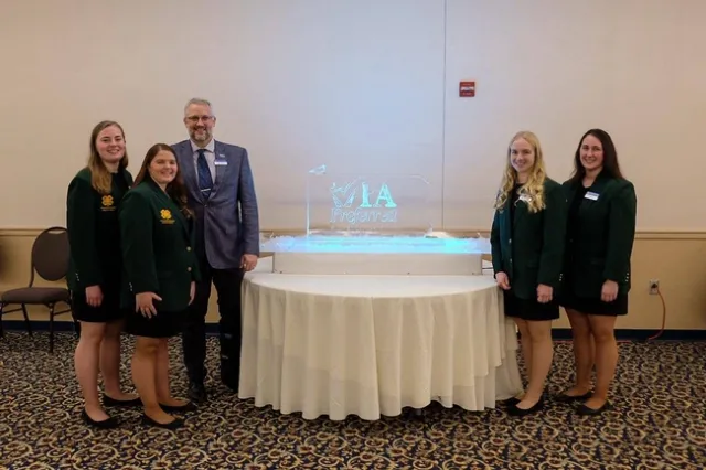 Brent Hales stands with 4-H youth