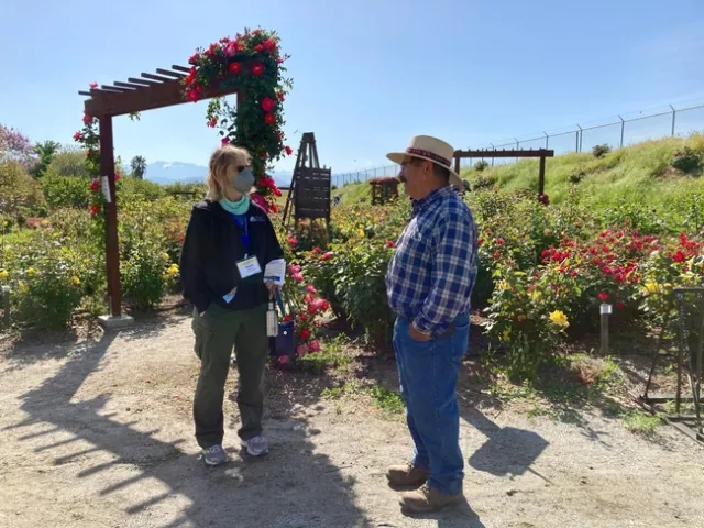 Pamela Byrnes, left, talks to Manuel Jimenez