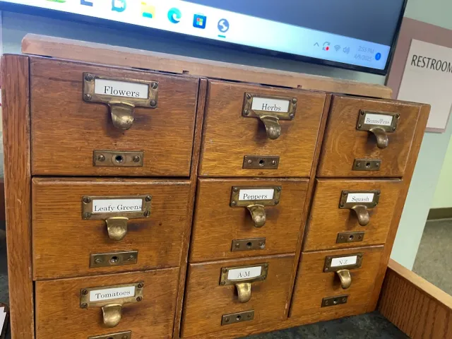 card catalog holding seeds