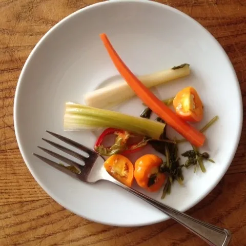 Pickled vegetables on a serving plate with fork