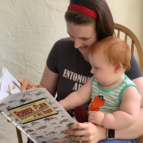 UC Davis doctoral candidate Charlotte Herbert Alberts reads to her son, Griffin, born in April of 2020.