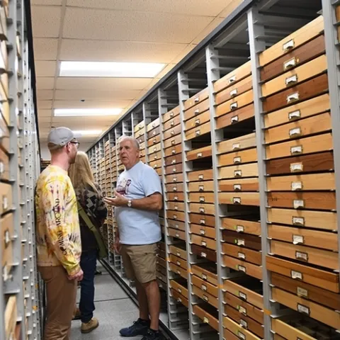 Entomologist Jeff Smith talks to visitors at a summer open house, pre-COVID precautions, at the Bohart Museum of Entomology. Smith curates the collection. (Photo by Kathy Keatley Garvey)