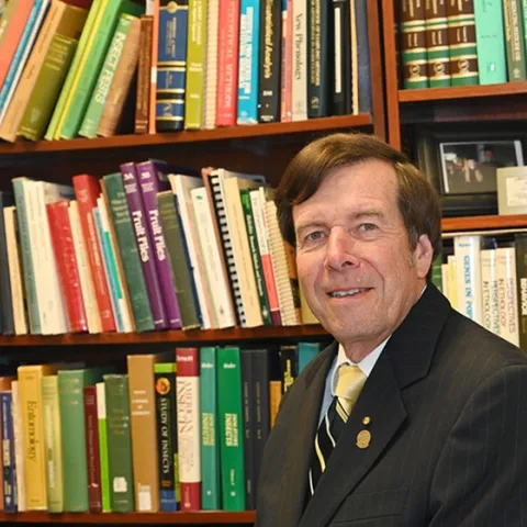 UC Davis distinguished professor Frank Zalom in his library. (Photo by Kathy Keatley Garvey)