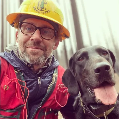 Tompkins pictured with his dog Boone.