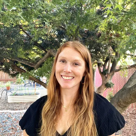 Lauren Fordyce standing outside under a tree. 