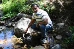 Safeeq Khan testing water quality.