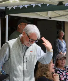 A man bowing.