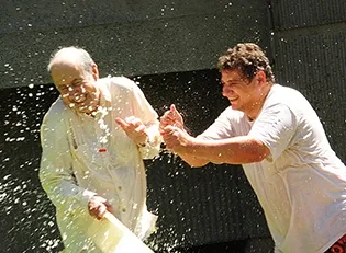 Researcher Christophe Morisseau (right) hits the target: distinguished professor Bruce Hammock. (Photo by Kathy Keatley Garvey)