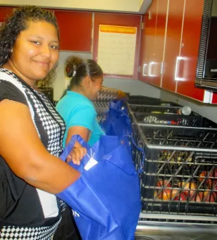 Creating food bags for the community.