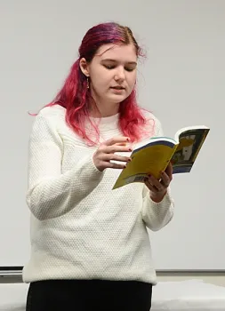 Elmira 4-H Club member Kailey Mauldin reads passages from the New York Times' bestseller,