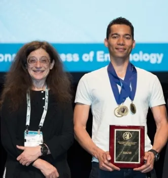 Ralph Washington Jr. has captained all the UC winning teams. With him in this 2016 photo is May Berenbaum, then president of ESA.