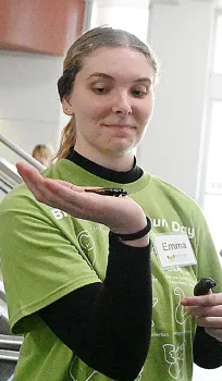 UC Davis doctoral student Emma Jochim of the Jason Bond lab, UC Davis Department of Entomology and Nematology, holds two Madagascar hissing cockroaches. (Photo by Kathy Keatley Garvey)