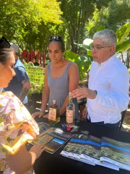A man and woman demonstrating products made with agave.