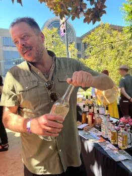 An agave grower and spirits importer opens a bottle of mezcal.