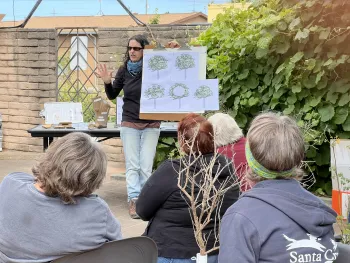 A Master Gardener teaching a class about pruning 